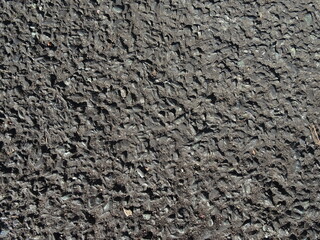 粗いアスファルトの質感をもつ背景