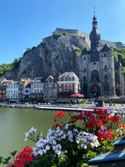 Scenic view of Dinant, Belgium, from the bridge on a sunny day, with the Collegiate Church of Notre-Dame and the citadel in the background