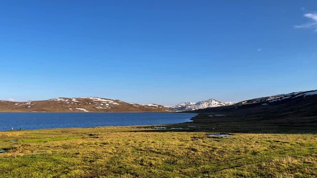 Sheosar Lake, located at 4,142 meters in Deosai National Park, Gilgit-Baltistan, Pakistan, features crystal-clear blue water and serene reflections. Ideal for nature, travel, beauty of Pakistan,