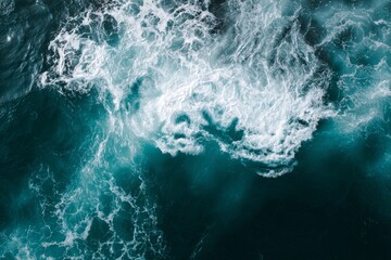 Fototapeta premium Aerial View of Ocean Waves Foaming Patterns and Deep Blue Sea Surfaces creating dynamic texture.