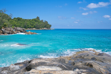 Naklejka premium Huge granites stones near beautiful turquoise beach on high tide, Mahe, Seychelles