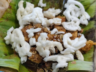 Tahu lontong, a delicious traditional Indonesian dish, lontong with peanut sauce, soy sauce, served...