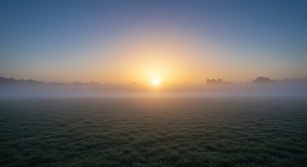 Fototapeta premium Sunrise over misty field