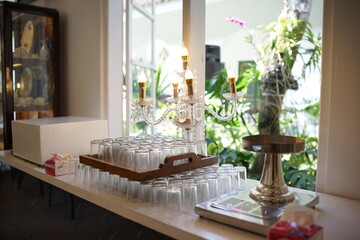 Elegant Glassware and Candle Holders on Display A Festive Table Setting