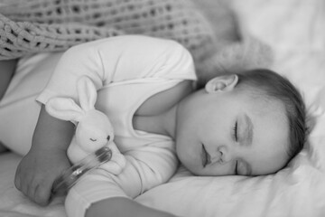 portrait of sleeping baby, Toddler Child Napping Resting During Daytime, Cute Little Baby Sleeping Lying On Side In Bed In Bedroom At Home