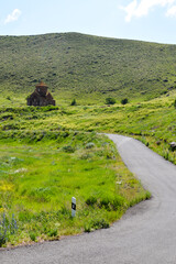 Temple in nature. Armenian church in the mountains. under the Monastery and beautiful nature. Cross on the dome of the church