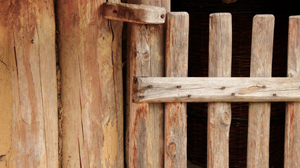 Rustic Vertical Timber Gate with Weathered Wooden Posts in Close-Up