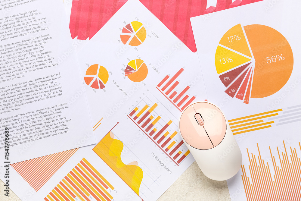 Fototapete Computer mouse with many business documents and graphics as background, closeup