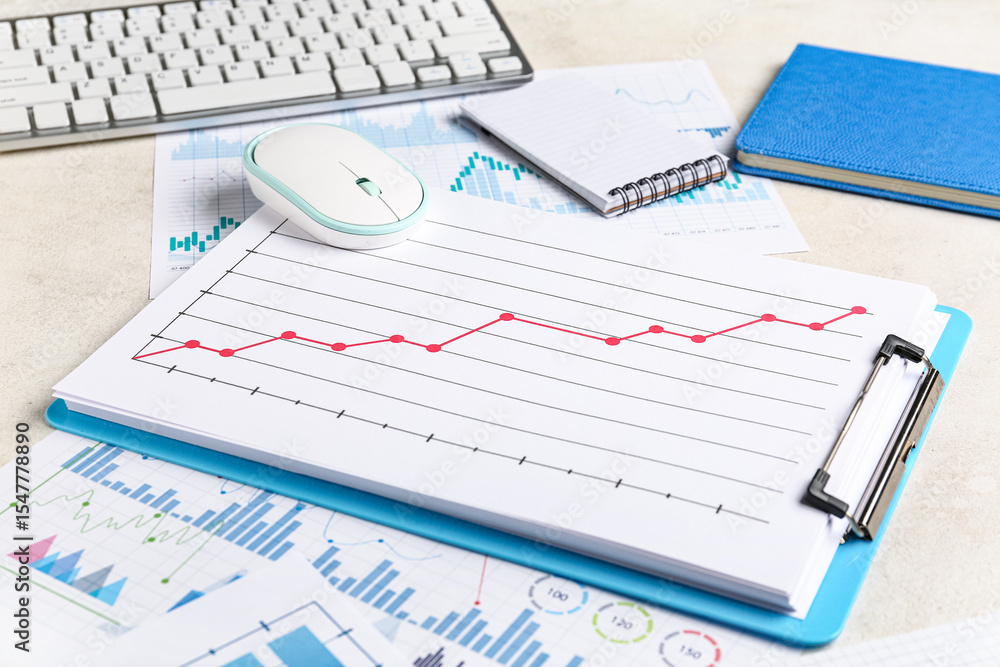 Fototapete Notebooks with keyboard, computer mouse, many business graphics and diagrams on white background