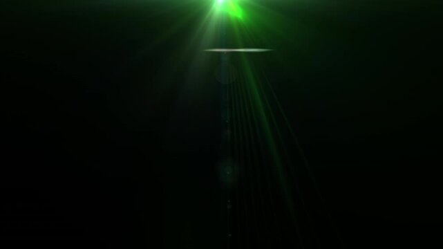 Loop glow green optical lens flares shine rays light burst moving from top left to right abstract on black background for screen project overlay. 4K beautiful green spotlight effects moving on top lef