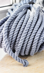 Thick Gray Rope Bundle on Light Surface - Perfect for Outdoor, Nautical, and Bushcraft Applications