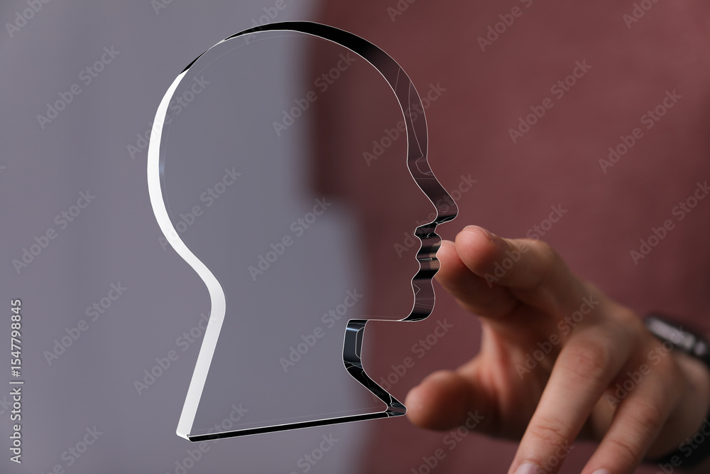 Poster abstract image of a person interacting with a translucent head profile, symbolizing identity, self-d