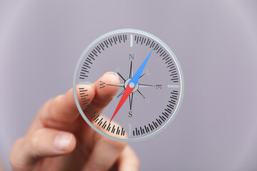 Person using a digital compass for navigation.  Find your way.
