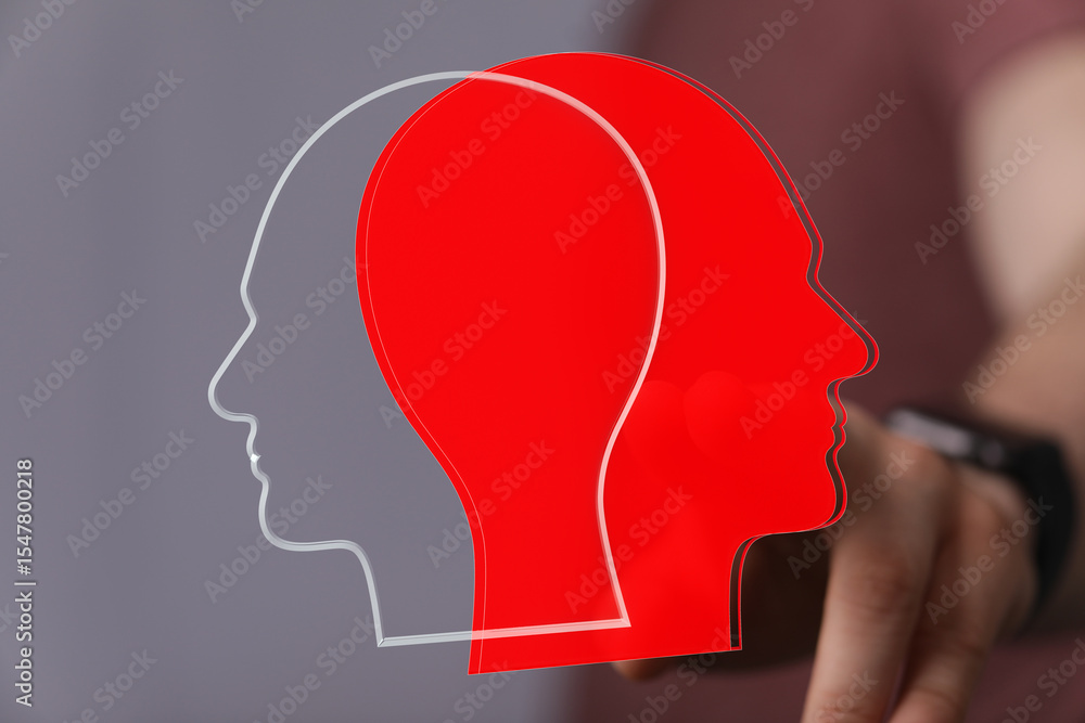 Poster abstract image of two heads, one red and one gray, overlapping. represents duality, unity, or connec