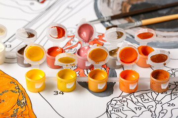 Set of cans with paints on canvas