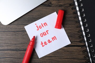 Paper note with phrase Join Our Team and stationery on wooden table, flat lay