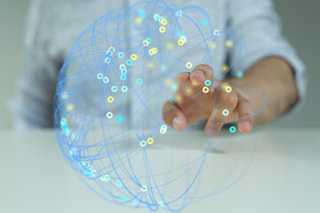 Person's hand interacts with a digital sphere representing global connections and data networks.