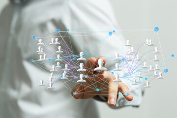 Image of a hand interacting with a digital network, illustrating connections and social media.