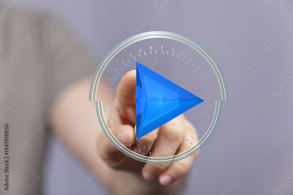 Poster Close-up of a hand interacting with a digital play button interface.  Modern technology concept.