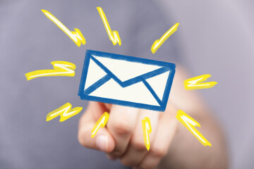 Image of a hand pointing at an email icon, signifying a new message or notification.