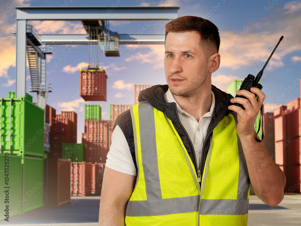 Poster man in container port. cargo customs point security specialist. container crane behind worker. custo
