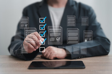 Digital checklist, Certificate Approved task management online planning concept, Businessman uses a tablet to document online marking, Document inspection and verification, Effective work organization