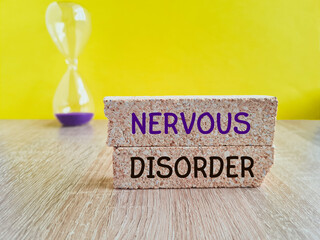 NERVOUS DISORDER symbol. Concept word NERVOUS Disorder on brick blocks. Beautiful yellow...