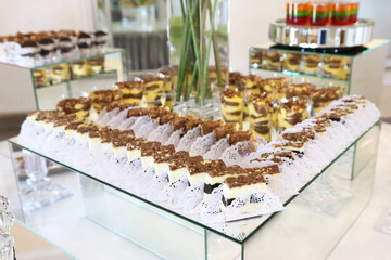 Obraz premium Beautiful sweet buffet with pastries, cakes and tartlets. Sweet desserts.