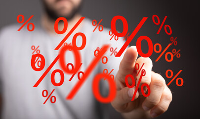 Image of a person interacting with digital percentage signs, ideal for finance, sales, and discount...