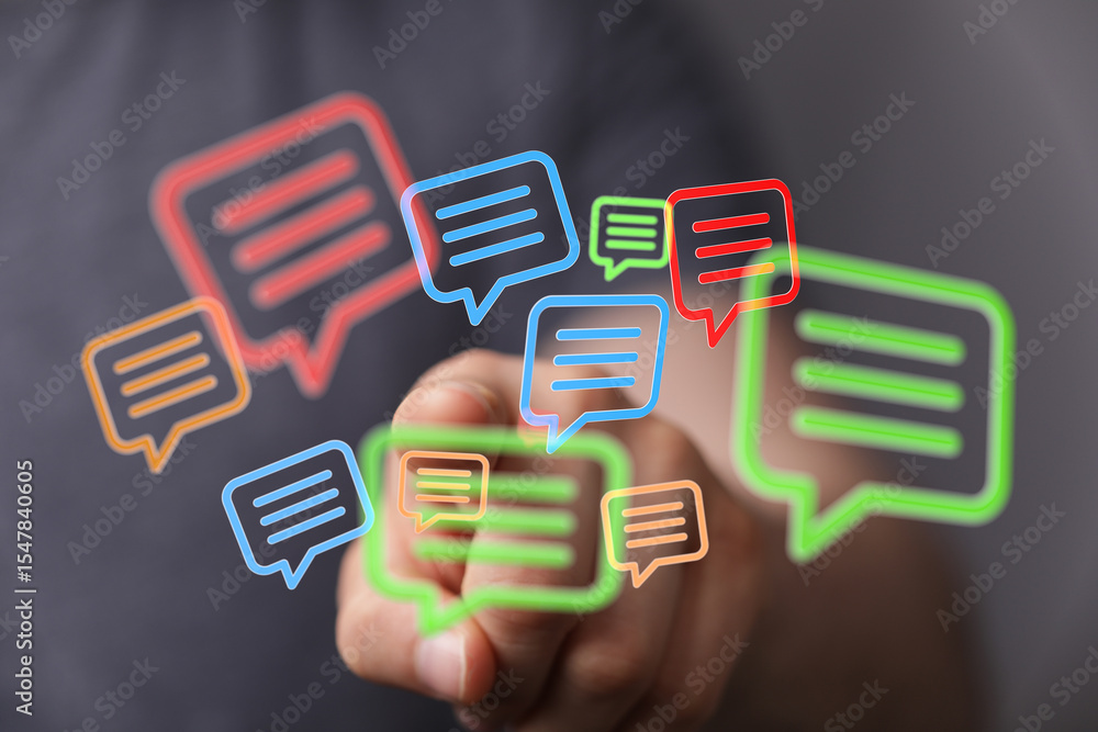Poster Abstract image of a hand interacting with colorful message bubbles, representing communication and social media.