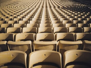 Fototapeta premium Endless Rows: A Visual Symphony of Stadium Seating in Warm Tones