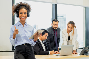 Happy woman, face and headphones in call center for customer service, telemarketing or support at office. Female person, consultant or agent smile with headset for online advice or help at workplace