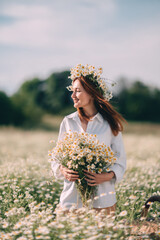 Daisy Wreath Woman Summer: Lady enjoys nature, holding flowers during summer picnic in daisies field.