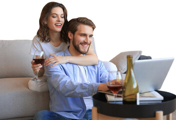 Happy couple sitting, relaxing on floor in living room, using laptop for online shopping together, watching movie on a transparent background