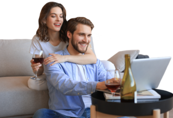 Happy couple sitting, relaxing on floor in living room, using laptop for online shopping together, watching movie on a transparent background