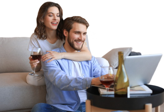 Happy couple sitting, relaxing on floor in living room, using laptop for online shopping together, watching movie on a transparent background