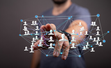 Image of a person interacting with a digital network of interconnected people, representing social...
