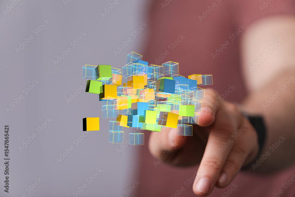 Poster Abstract image of a hand interacting with colorful 3D cubes, representing data, technology, or innovation.