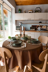 Cozy Rustic Dining Room Interior with Wooden Furniture, Green Table Setting, and Natural Light Kitchen Design, Beige and Brown Color Palette