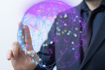A businessman interacts with a digital globe, illustrating global networking and connectivity.