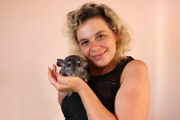People care for and play with chinchillas.