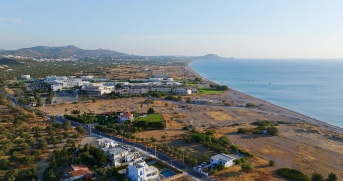 Aerial tilt shot overlooking the coastline of Afandou, sunrise in Rhodes, Greece