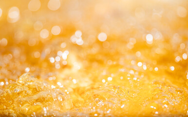 Close up bright orange Oil or beer splash texture and nature waves, Beautiful waves curve and...