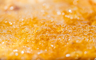 Close up bright orange Oil or beer splash texture and nature waves, Beautiful waves curve and...