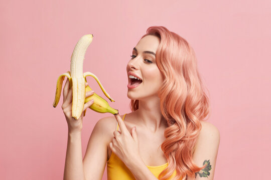 alluring female interacting with really large banana in suggestive manner