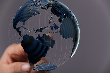 High-tech image of a hand interacting with a 3D model of Earth, representing global connectivity...
