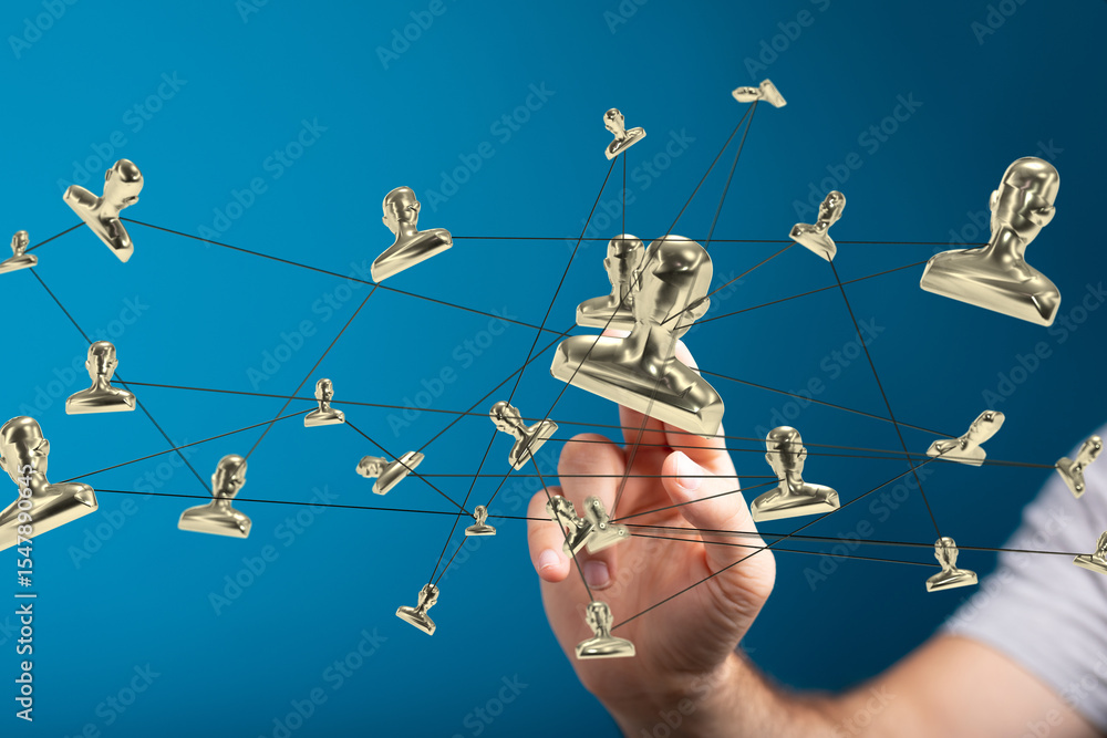Aufkleber image of a hand interacting with a network of golden profile icons, symbolizing global connections a