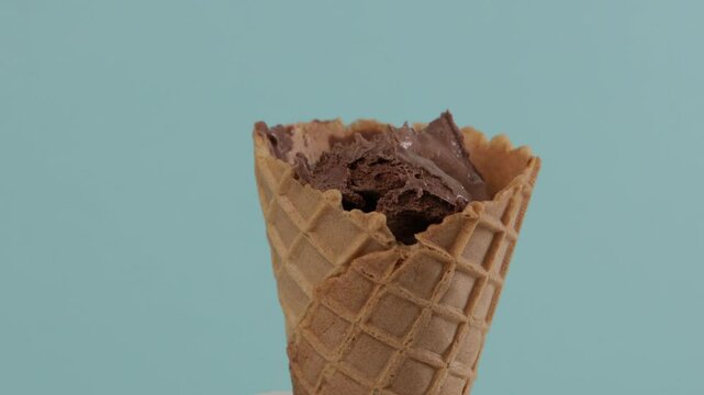 chocolate ice cream put in wafer coner