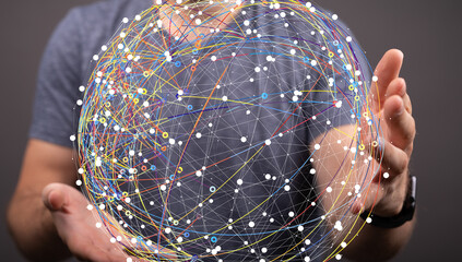 Image of a person holding a digital globe, representing global network, connection, and technology.