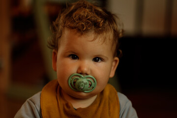 Sweet image of a toddler with a pacifier. Perfect for blogs, parenting websites, and more.